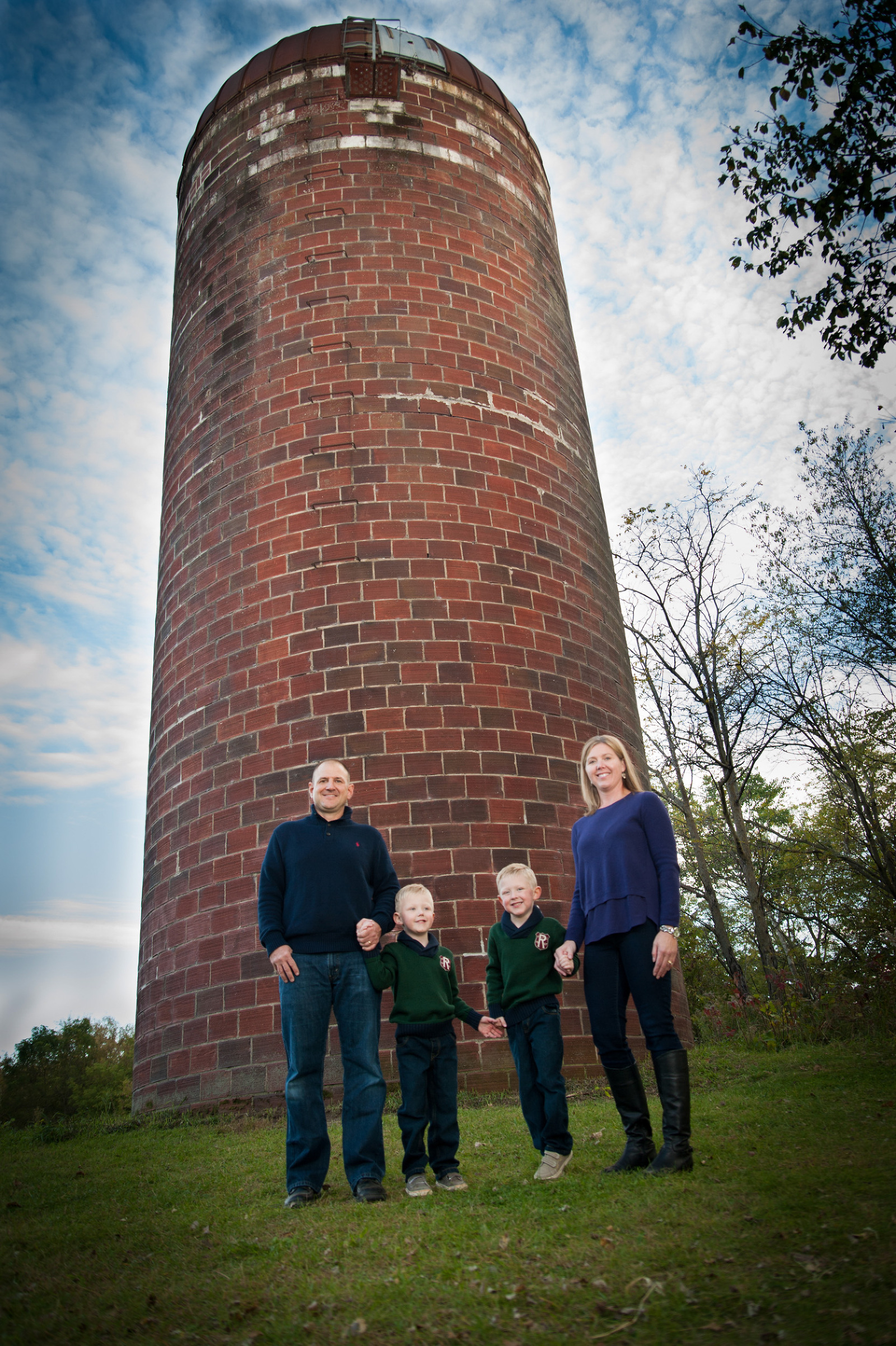 family in from of silo